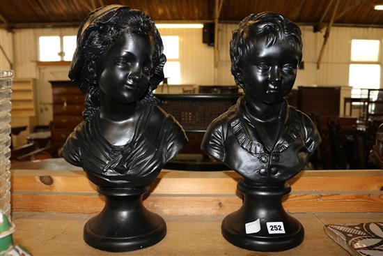 Pair black painted busts of a boy & girl